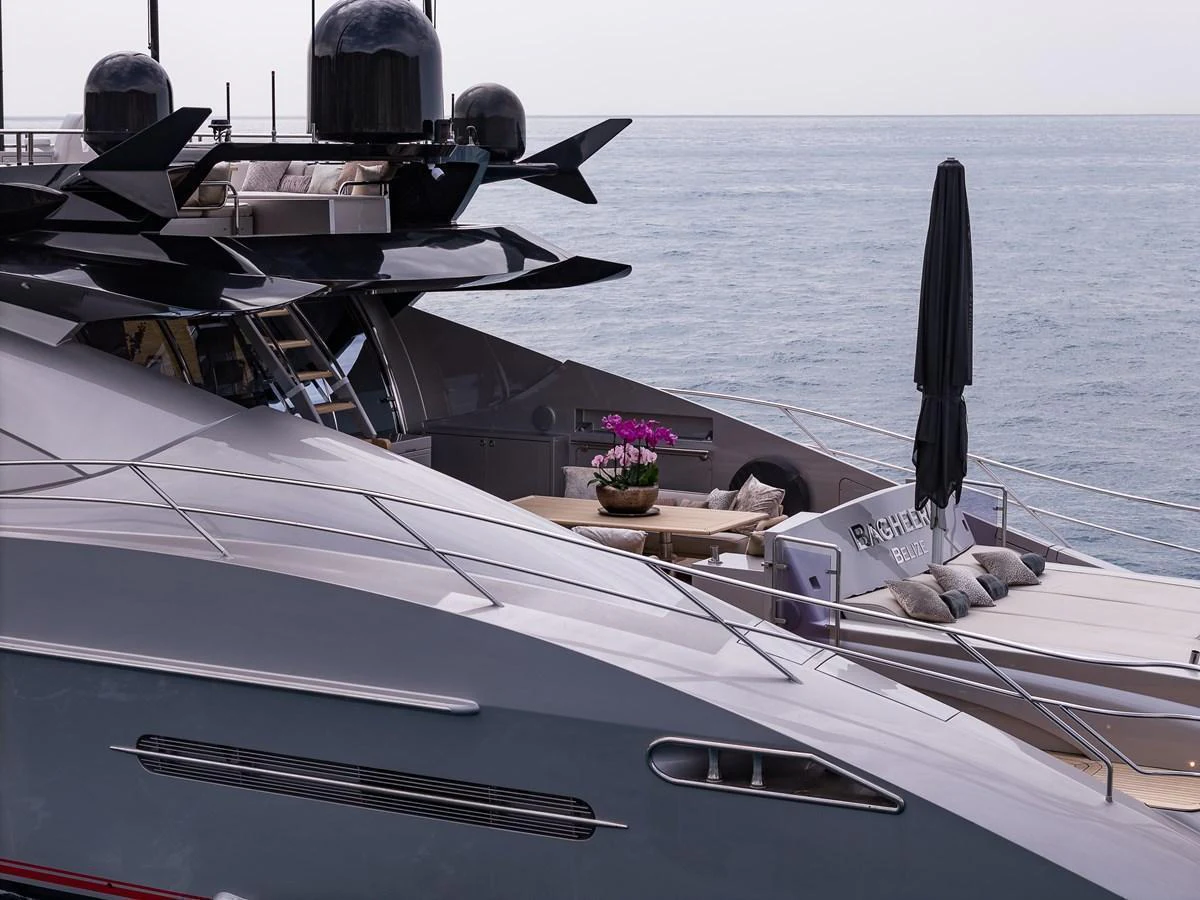 The yacht features a sleek and modern exterior design with a luxurious lounging area on the deck. aboard BAGHEERA Yacht for Sale