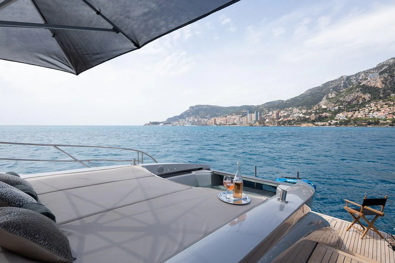 The sundeck offers a luxurious lounging area with stunning ocean views and a refreshing drink setup. aboard BAGHEERA Yacht for Sale