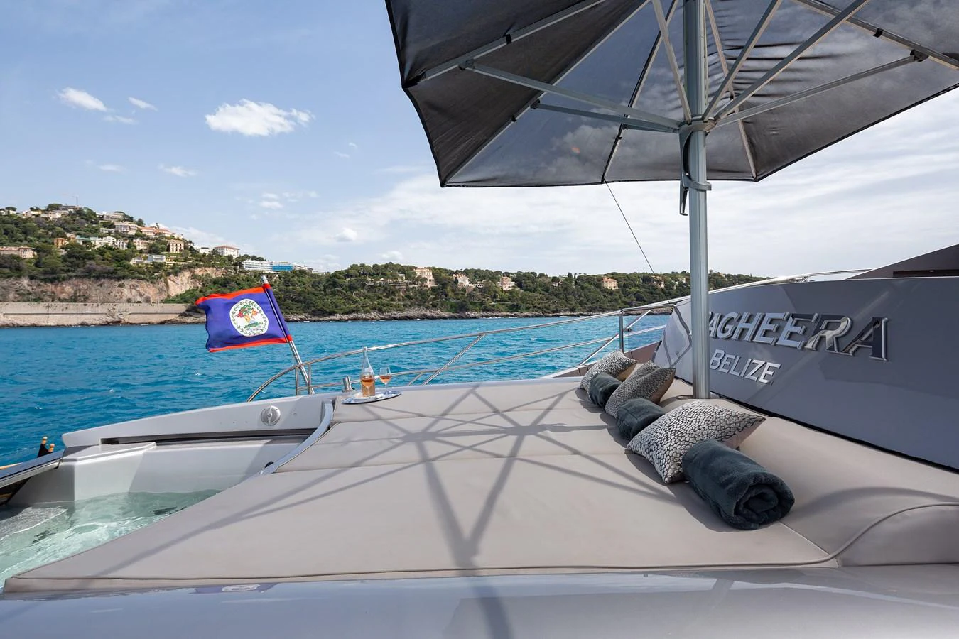 The sundeck offers a luxurious lounging area with plush cushions and a large umbrella, perfect for relaxation while enjoying the scenic views. aboard BAGHEERA Yacht for Sale