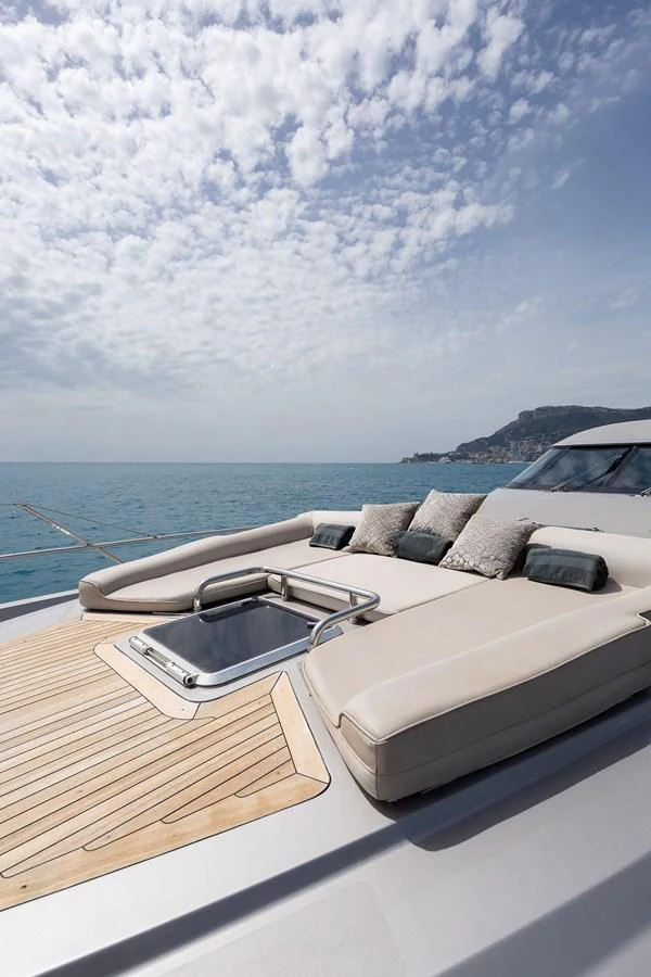 The foredeck features a luxurious sunbathing area with plush cushions and a sleek design. aboard BAGHEERA Yacht for Sale