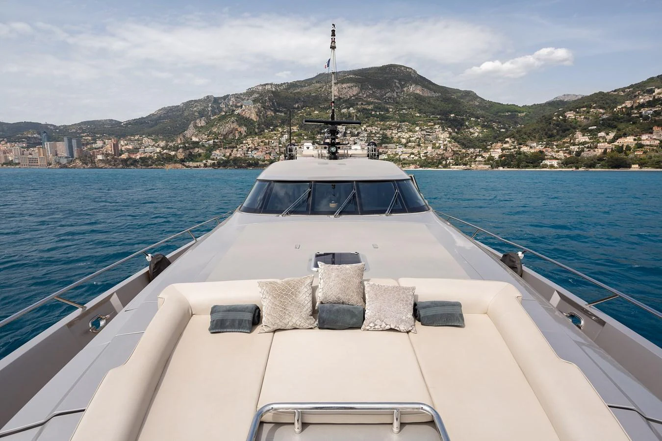The yacht's foredeck offers a luxurious sunbathing area with plush cushions and stunning views of the coastline. aboard BAGHEERA Yacht for Sale