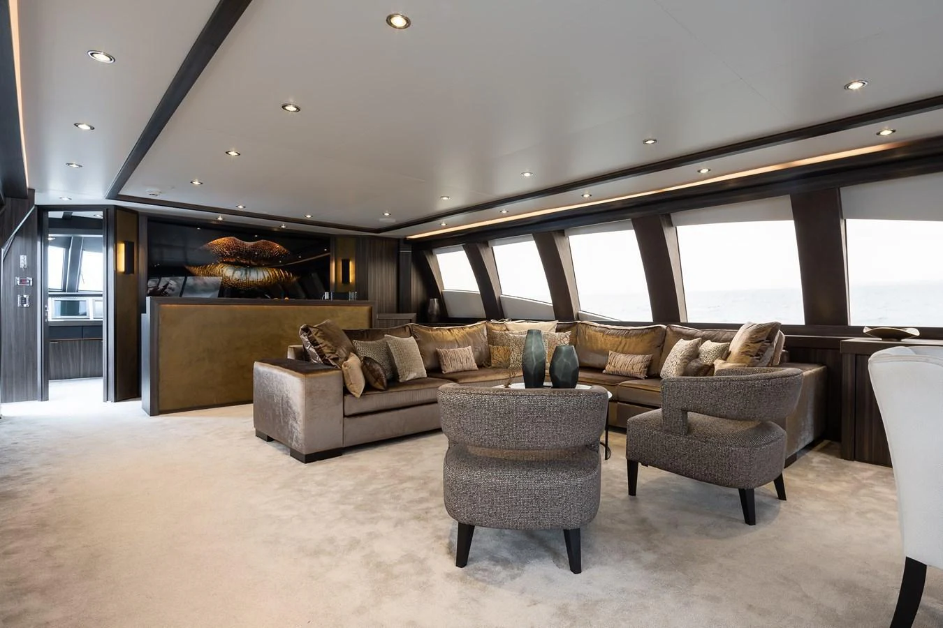 The luxurious salon features plush seating and elegant decor, offering a comfortable and stylish space for relaxation. aboard BAGHEERA Yacht for Sale