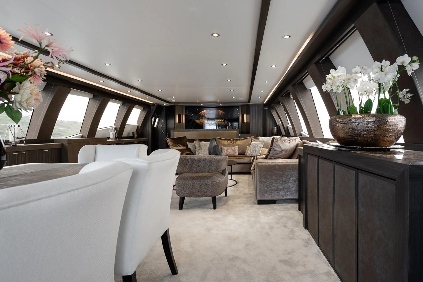 The yacht's salon features elegant seating, modern decor, and ample natural light. aboard BAGHEERA Yacht for Sale
