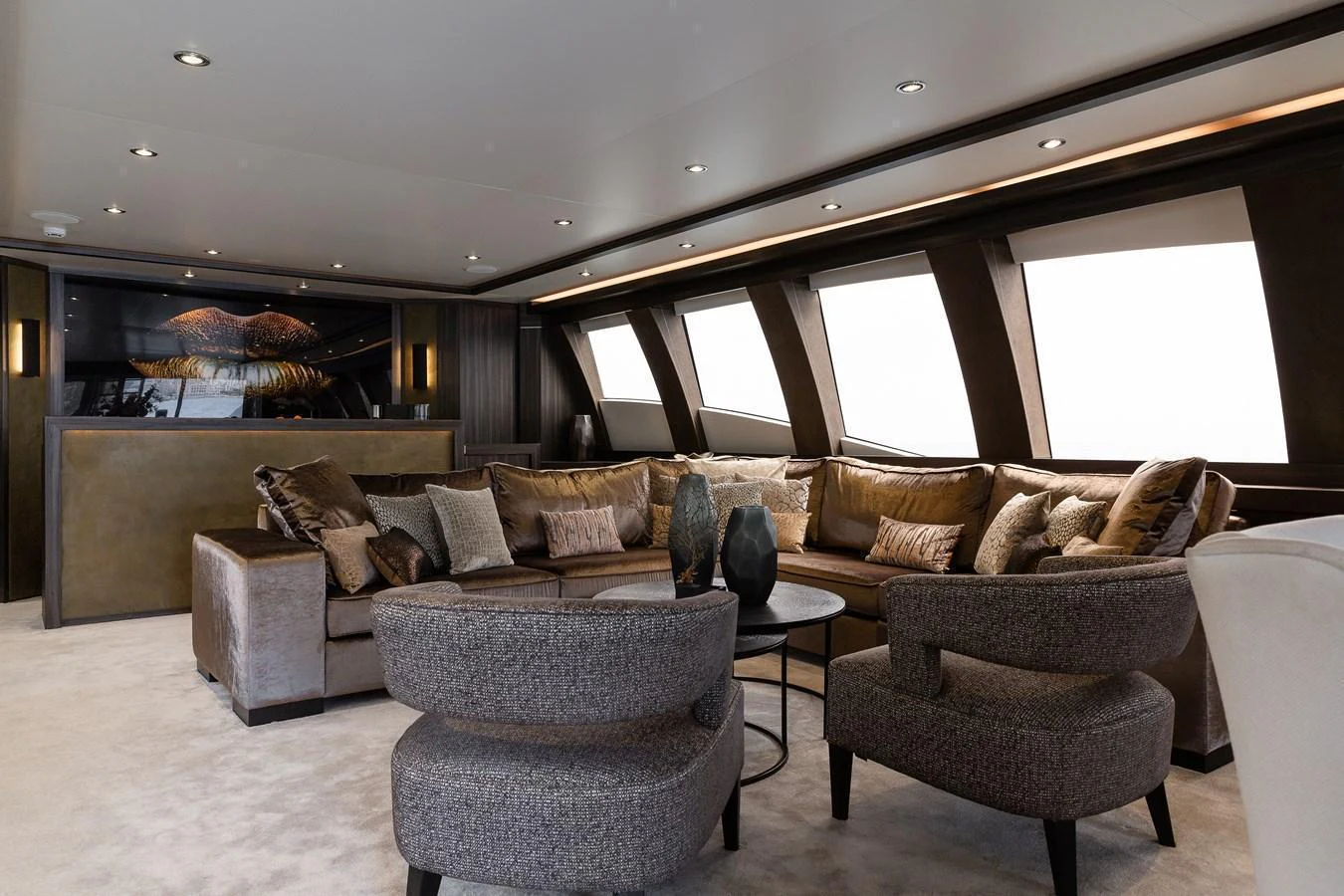 The salon features plush seating and large windows, creating a luxurious and inviting atmosphere. aboard BAGHEERA Yacht for Sale