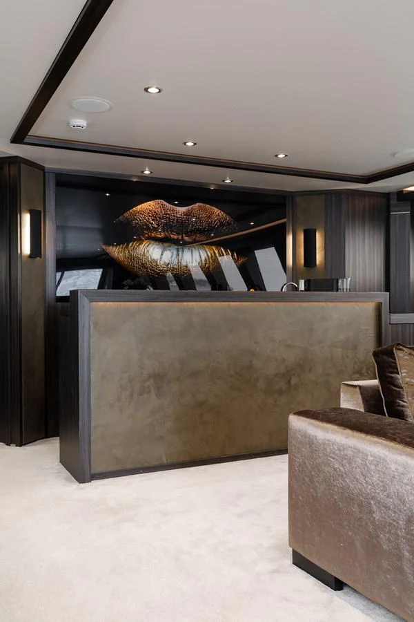 A luxurious yacht interior featuring a stylish bar area with modern decor. aboard BAGHEERA Yacht for Sale