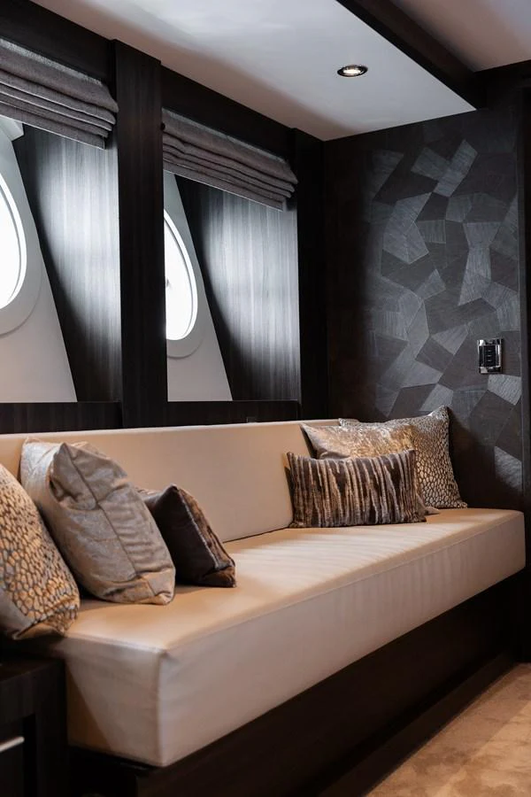 The yacht's interior features a stylish seating area with plush cushions and modern decor. aboard BAGHEERA Yacht for Sale