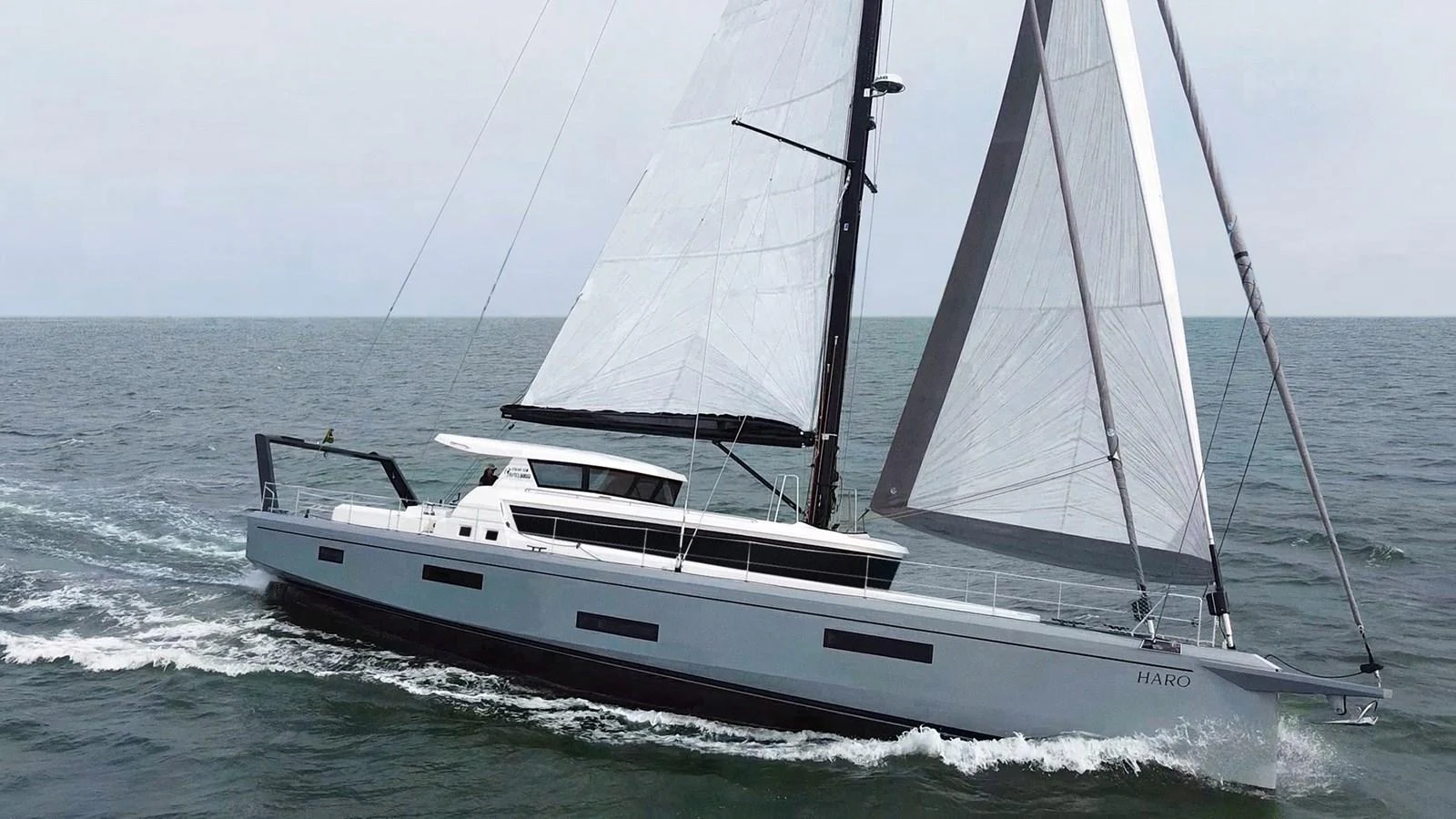 A sleek sailing yacht glides gracefully on the open sea, showcasing its modern design and impressive sails. aboard 2025 MCP GLOBAL EXP 68 Yacht for Sale