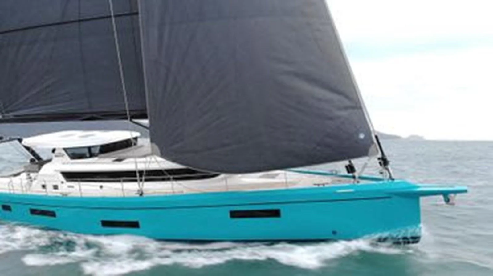 A sleek yacht with turquoise hull and dark sails glides smoothly on the water. aboard 2025 MCP GLOBAL EXP 68 Yacht for Sale