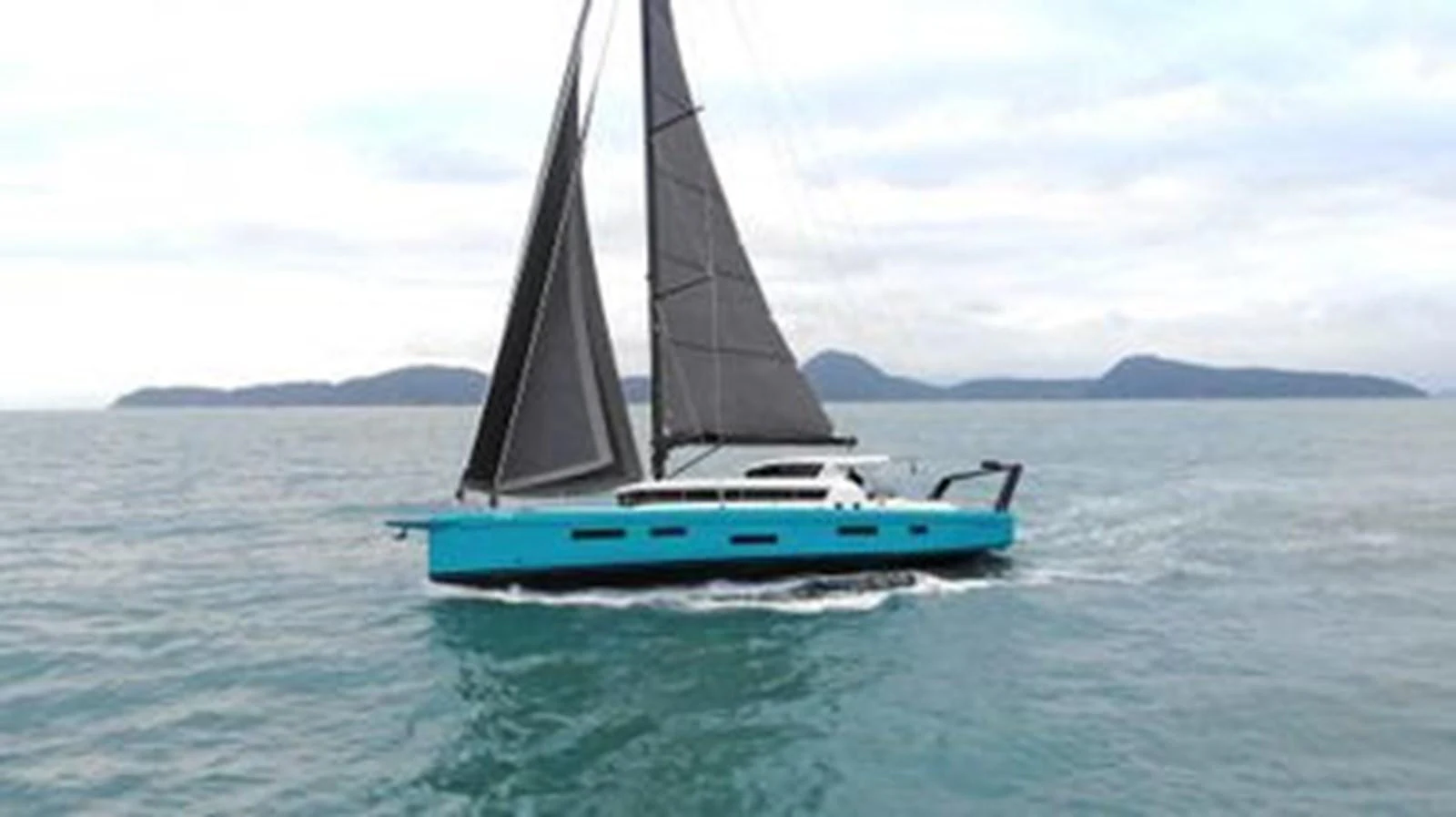 A sleek sailing yacht with striking blue hull glides gracefully on the open water. aboard 2025 MCP GLOBAL EXP 68 Yacht for Sale