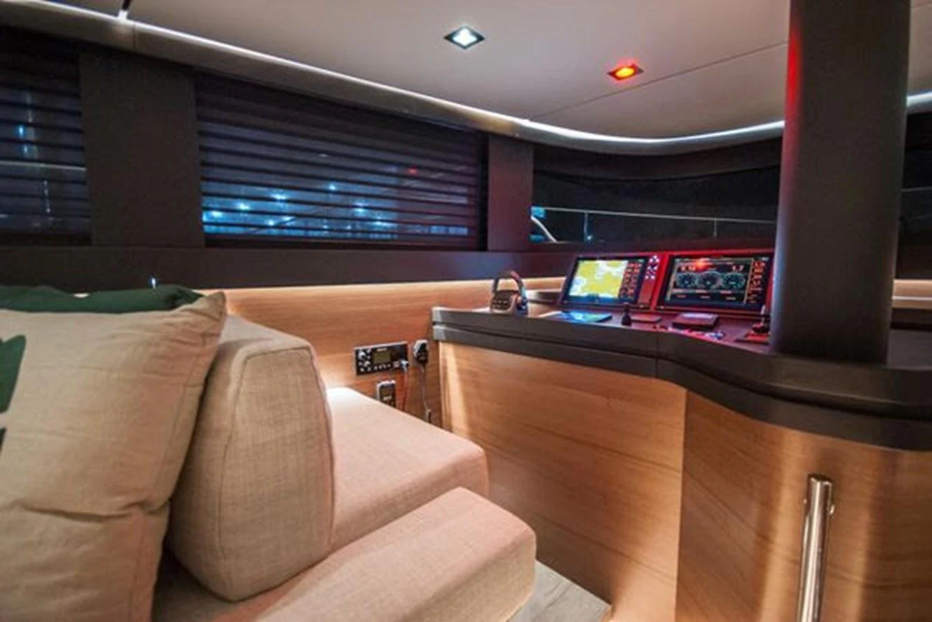 The helm station features modern navigation equipment and a comfortable seating area. aboard 2025 MCP GLOBAL EXP 68 Yacht for Sale