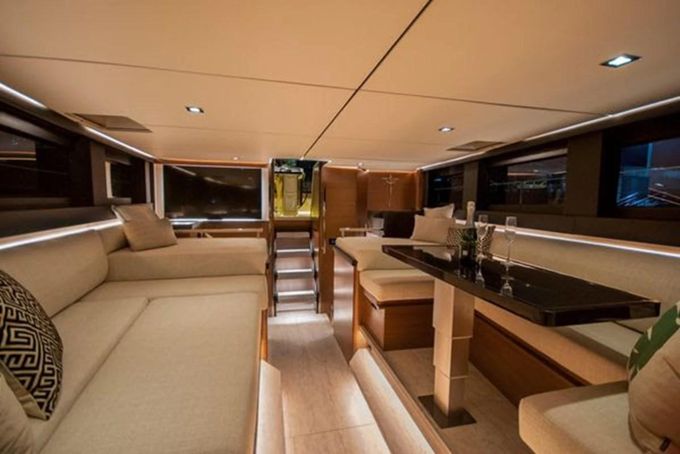 The yacht's salon features elegant seating and a stylish dining area, creating a luxurious and inviting atmosphere. aboard 2025 MCP GLOBAL EXP 68 Yacht for Sale