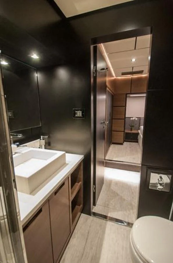 A sleek and modern yacht bathroom with a minimalist design. aboard 2025 MCP GLOBAL EXP 68 Yacht for Sale