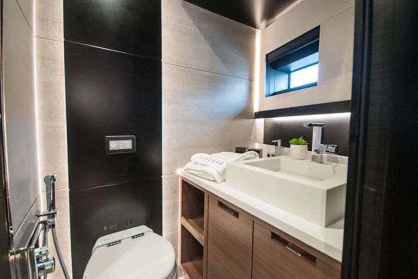 A sleek and modern yacht bathroom with stylish fixtures and ample lighting. aboard 2025 MCP GLOBAL EXP 68 Yacht for Sale