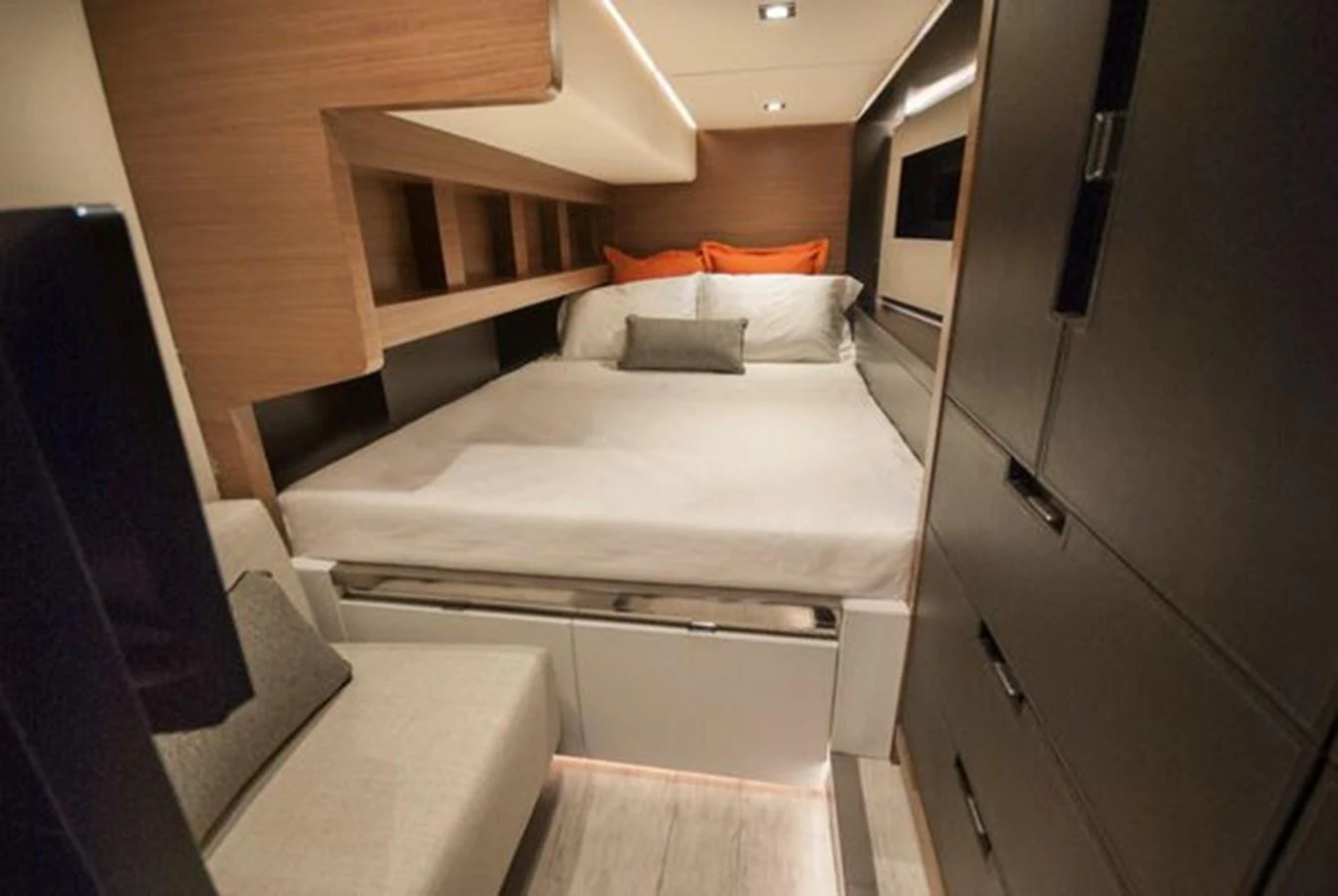 A cozy stateroom featuring a comfortable bed with modern furnishings and ambient lighting. aboard 2025 MCP GLOBAL EXP 68 Yacht for Sale