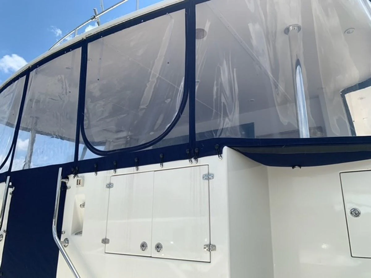 The yacht features a sleek exterior with clear protective panels and a polished finish. aboard THE CAT FROM THE HAT Yacht for Sale