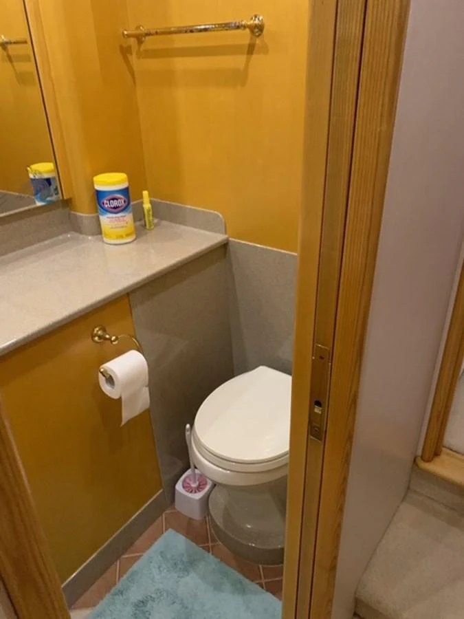 A compact and well-maintained yacht bathroom with essential amenities. aboard THE CAT FROM THE HAT Yacht for Sale