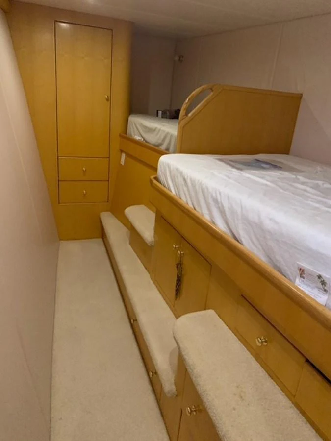 A cozy cabin with bunk beds and ample storage space. aboard THE CAT FROM THE HAT Yacht for Sale