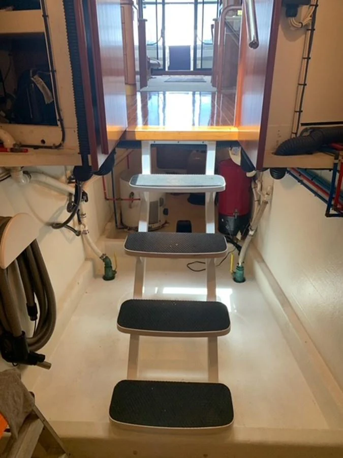 A view of the interior stairs leading up to the main deck, showcasing a clean and functional design. aboard THE CAT FROM THE HAT Yacht for Sale