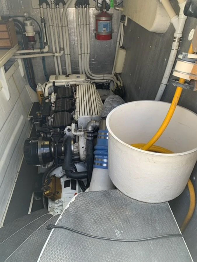 The image showcases the engine room of the yacht, featuring mechanical components and essential equipment. aboard THE CAT FROM THE HAT Yacht for Sale