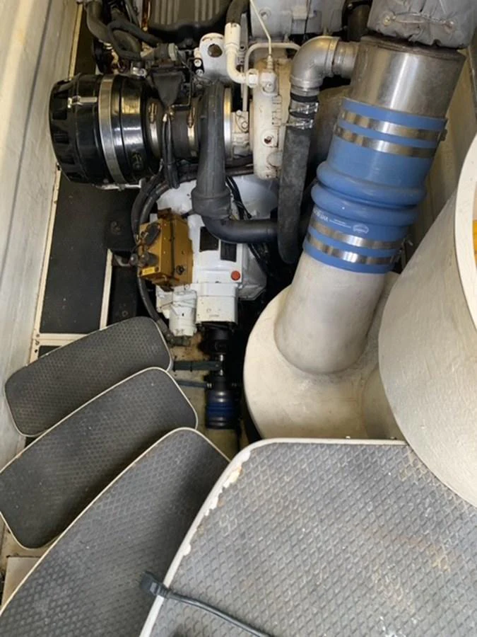 The image showcases the engine room with visible machinery and components. aboard THE CAT FROM THE HAT Yacht for Sale