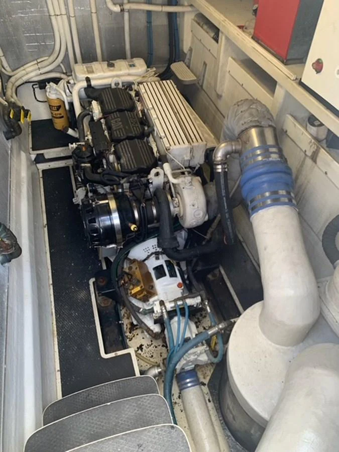 The image showcases the yacht's engine room with visible machinery and components. aboard THE CAT FROM THE HAT Yacht for Sale
