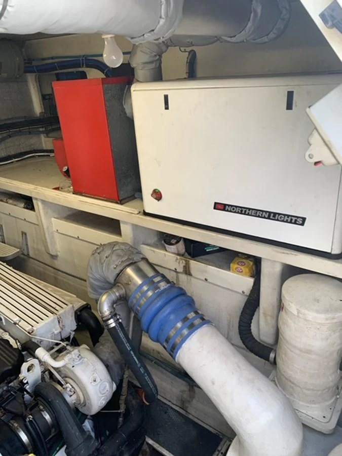 The image shows a detailed view of the yacht's engine room, highlighting the mechanical components and equipment. aboard THE CAT FROM THE HAT Yacht for Sale