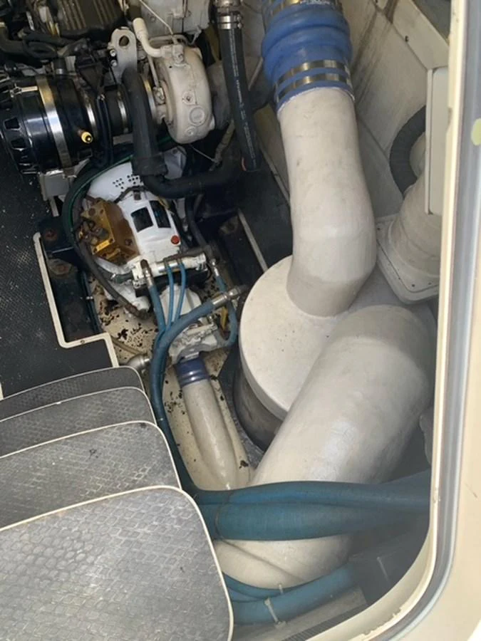 A close-up view of the yacht's engine room showcasing mechanical components and piping. aboard THE CAT FROM THE HAT Yacht for Sale