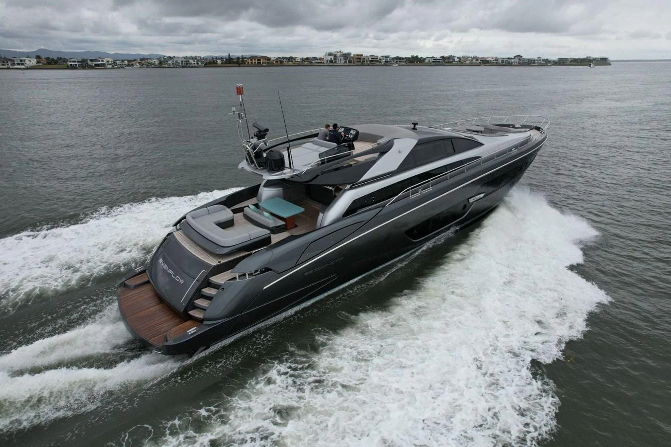 A sleek and modern yacht cruises through the water, showcasing its elegant design and spacious deck. aboard EVENFLOW Yacht for Sale