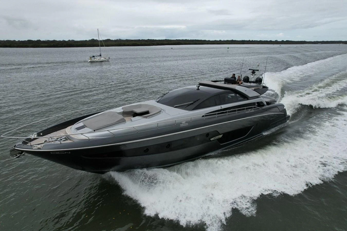 A sleek, modern yacht cruises swiftly through calm waters, showcasing its elegant design and powerful performance. aboard EVENFLOW Yacht for Sale
