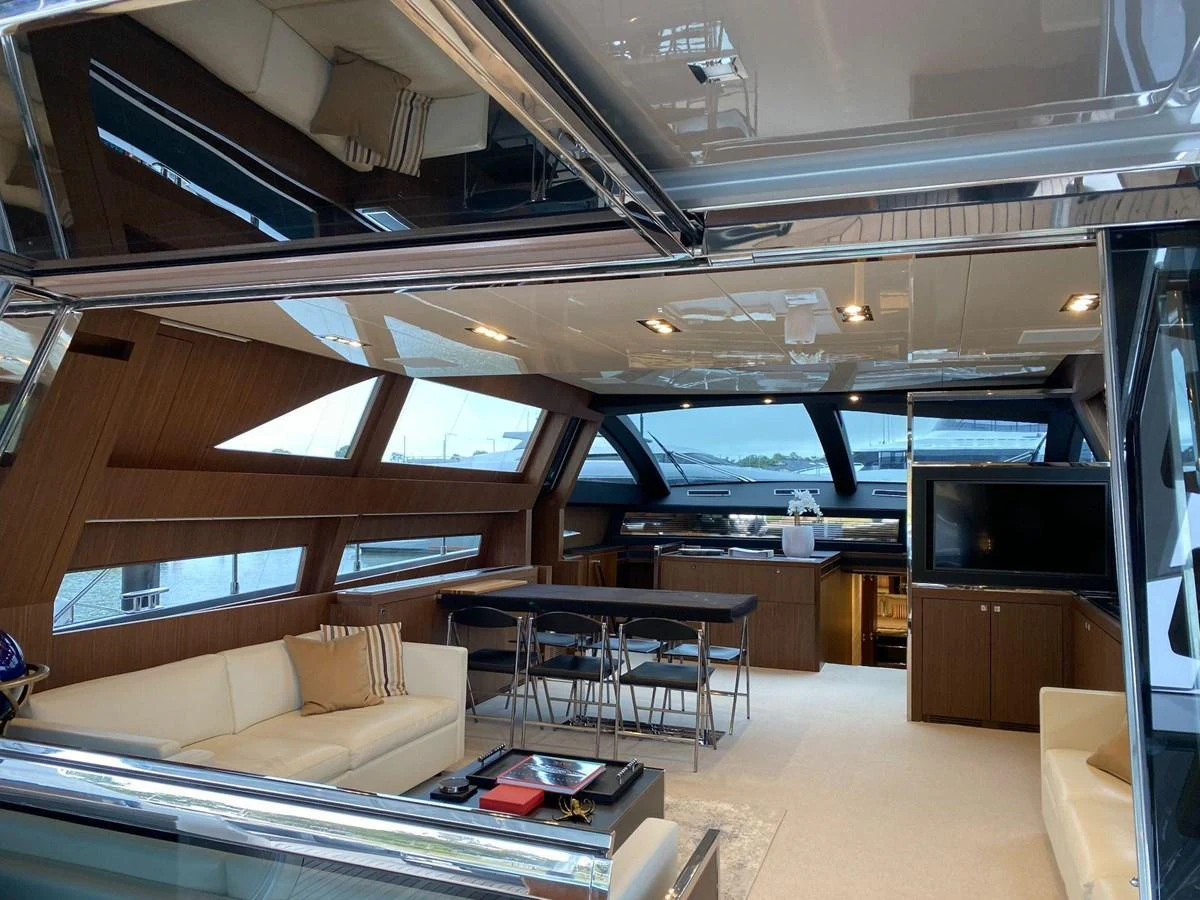 The yacht's salon features a spacious and modern design with ample seating and large windows for natural light. aboard EVENFLOW Yacht for Sale