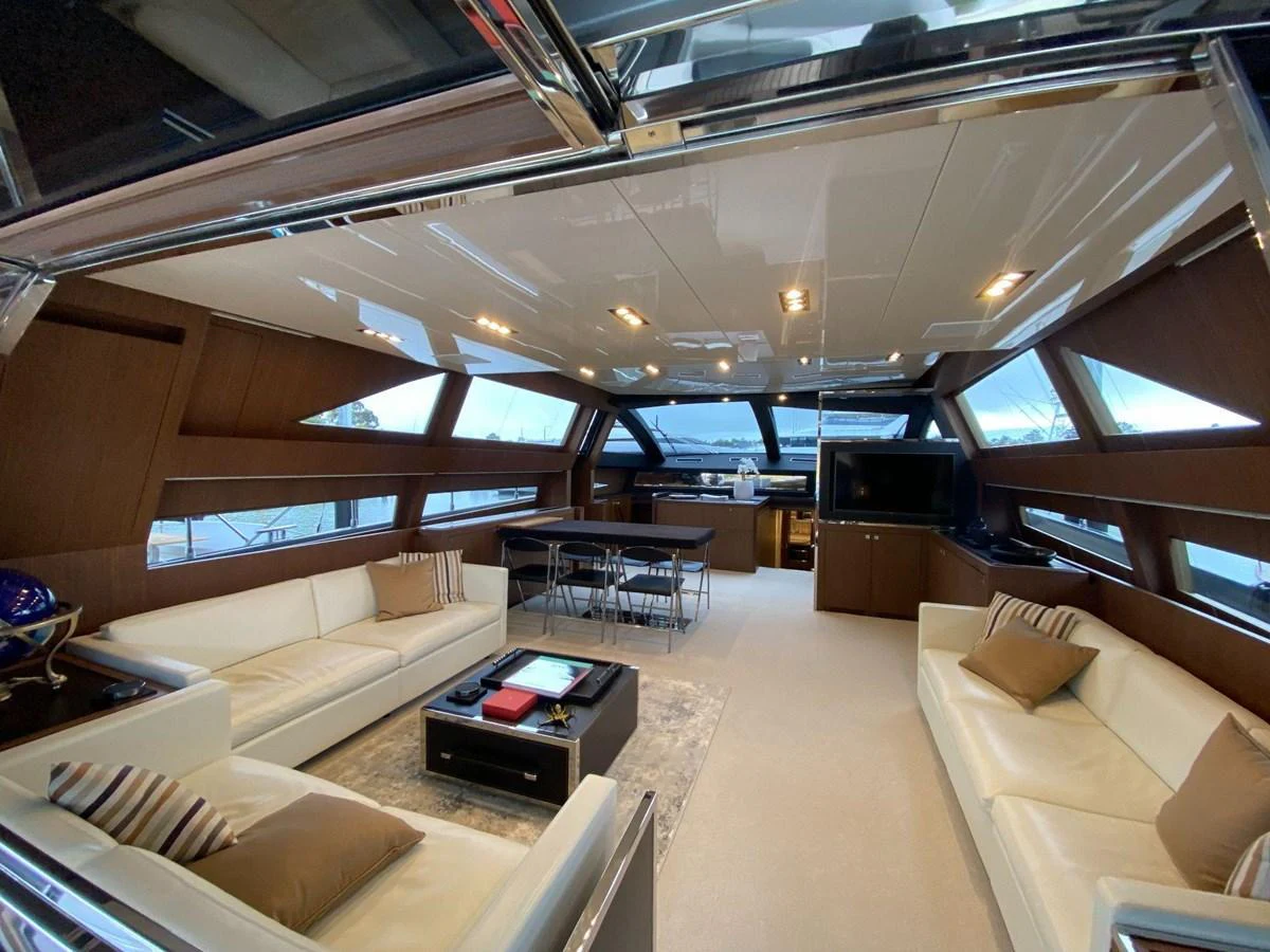 The salon features luxurious seating, a dining area, and large windows for panoramic views. aboard EVENFLOW Yacht for Sale