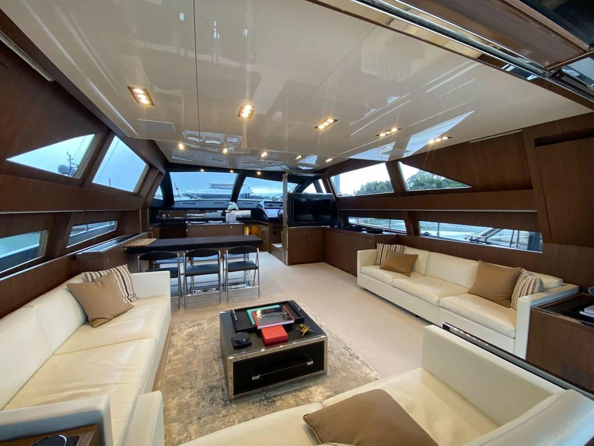 The spacious salon features luxurious seating and panoramic windows for an elegant and comfortable experience. aboard EVENFLOW Yacht for Sale