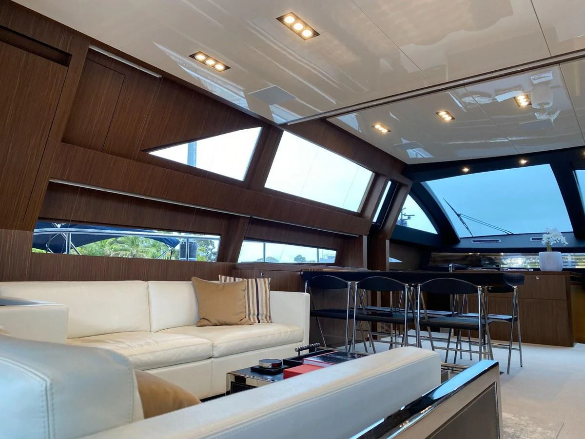 The salon features a modern design with ample natural light and comfortable seating. aboard EVENFLOW Yacht for Sale