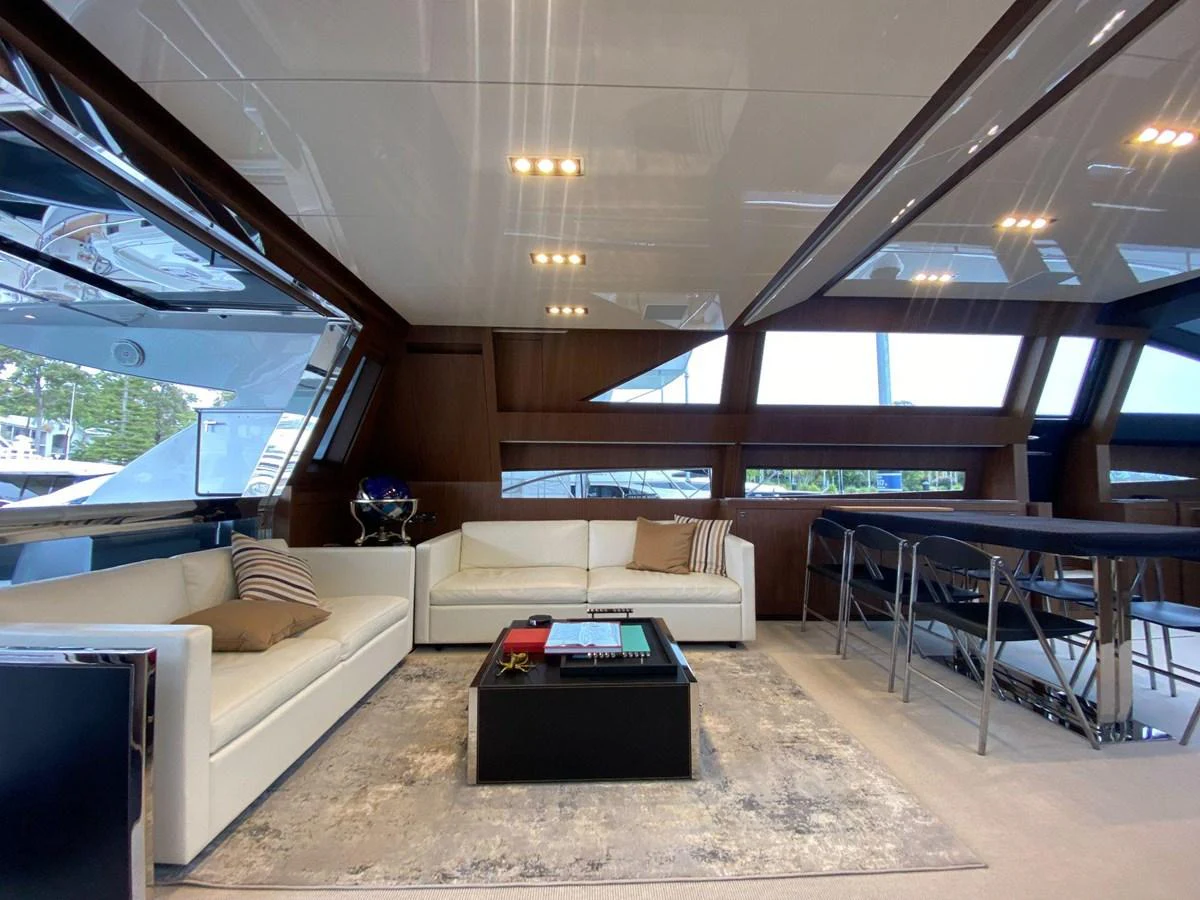 The salon features luxurious seating with modern decor and ample natural light. aboard EVENFLOW Yacht for Sale