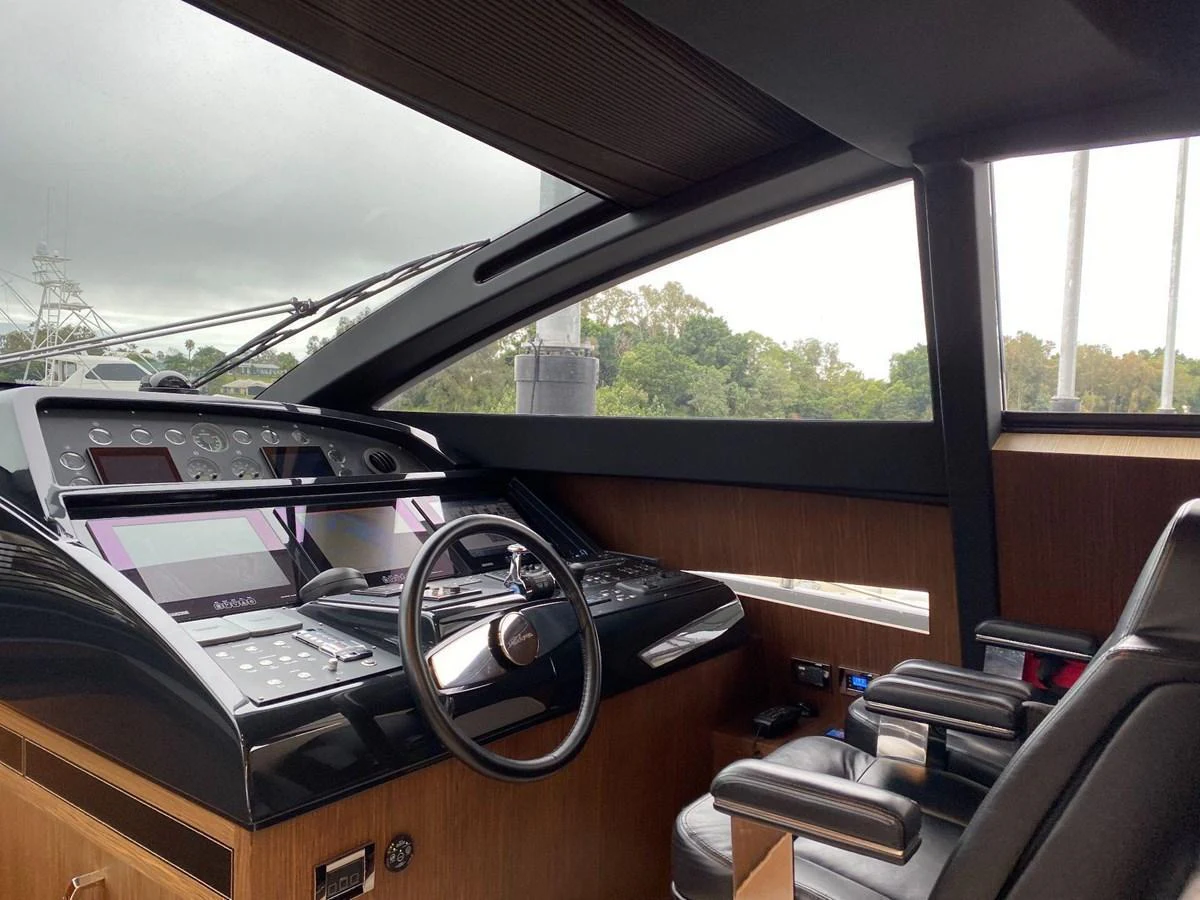 The helm station features a sleek, modern design with advanced navigation equipment and comfortable seating. aboard EVENFLOW Yacht for Sale