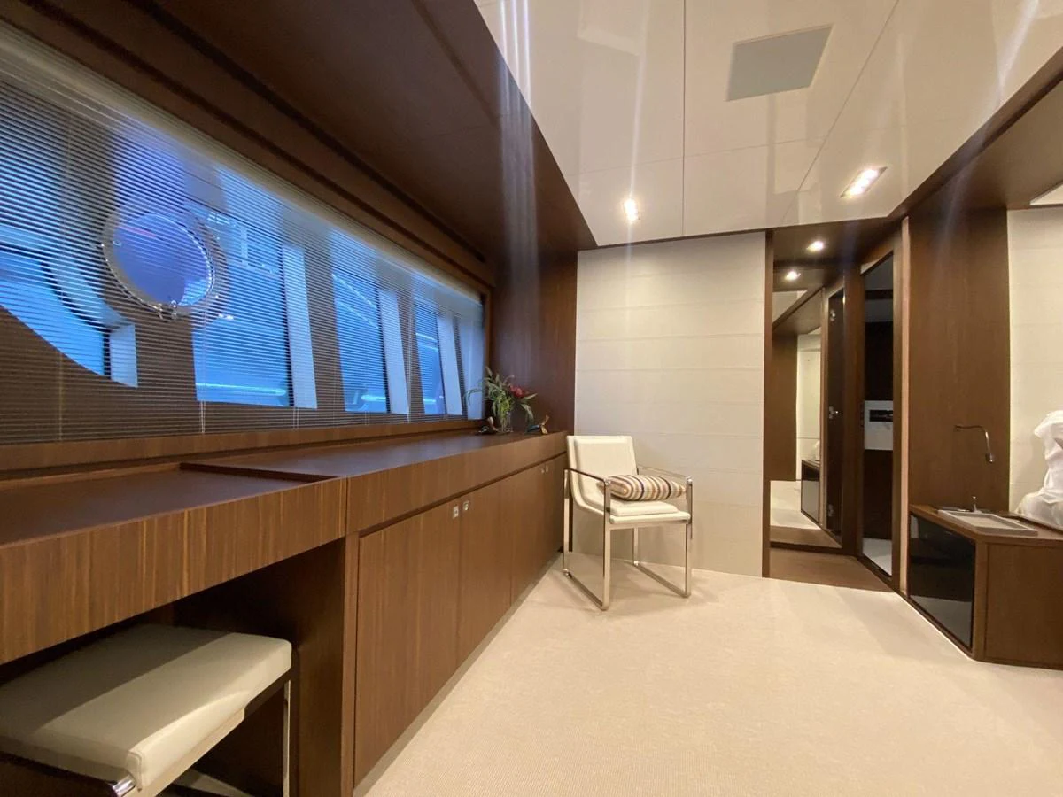 The yacht's interior features a modern, elegant design with wooden accents and ample natural light. aboard EVENFLOW Yacht for Sale
