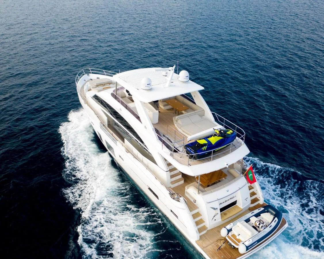 A luxurious yacht cruises through the open sea, showcasing its sleek design and spacious decks. aboard RAGARDA Yacht for Sale