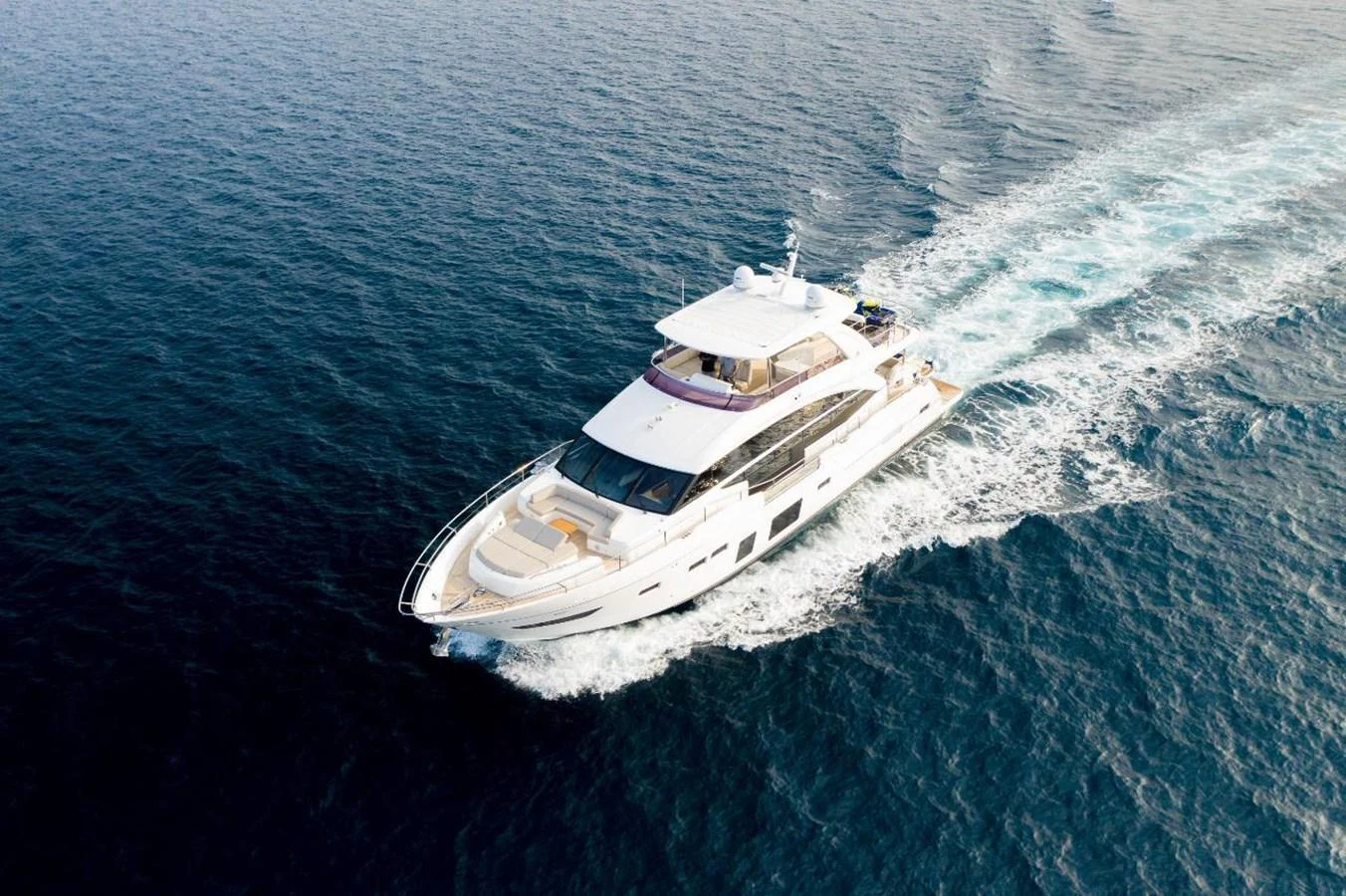 This sleek yacht glides effortlessly through the open sea, showcasing its elegant design and luxurious features. aboard RAGARDA Yacht for Sale