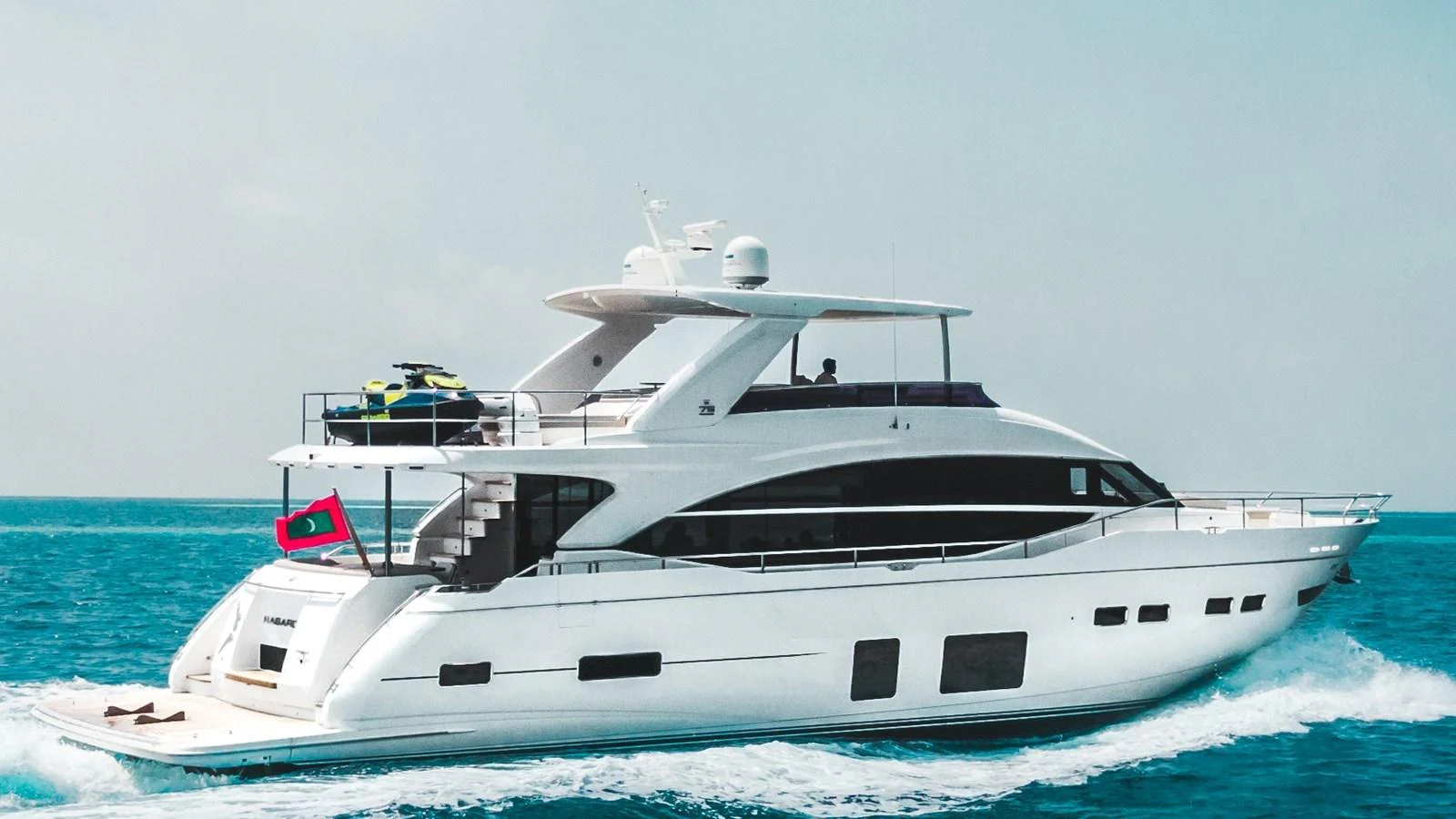 A sleek and modern yacht cruising on the open sea, showcasing its elegant design and luxurious amenities. aboard RAGARDA Yacht for Sale