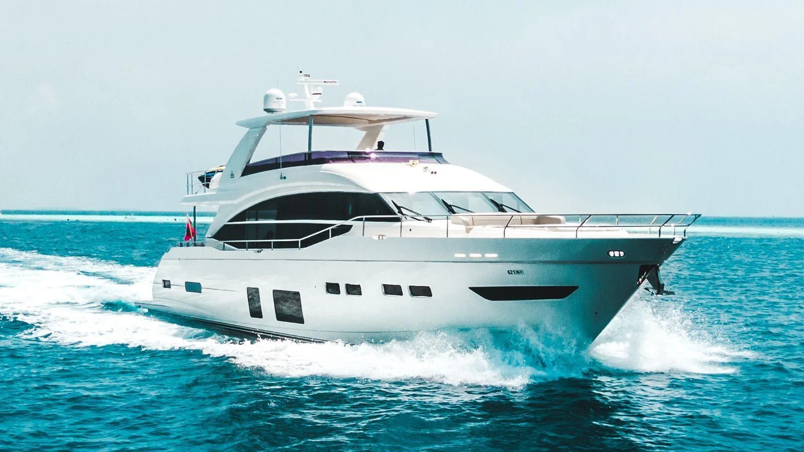 A sleek and modern yacht cruises through the open water, showcasing its elegant design. aboard RAGARDA Yacht for Sale