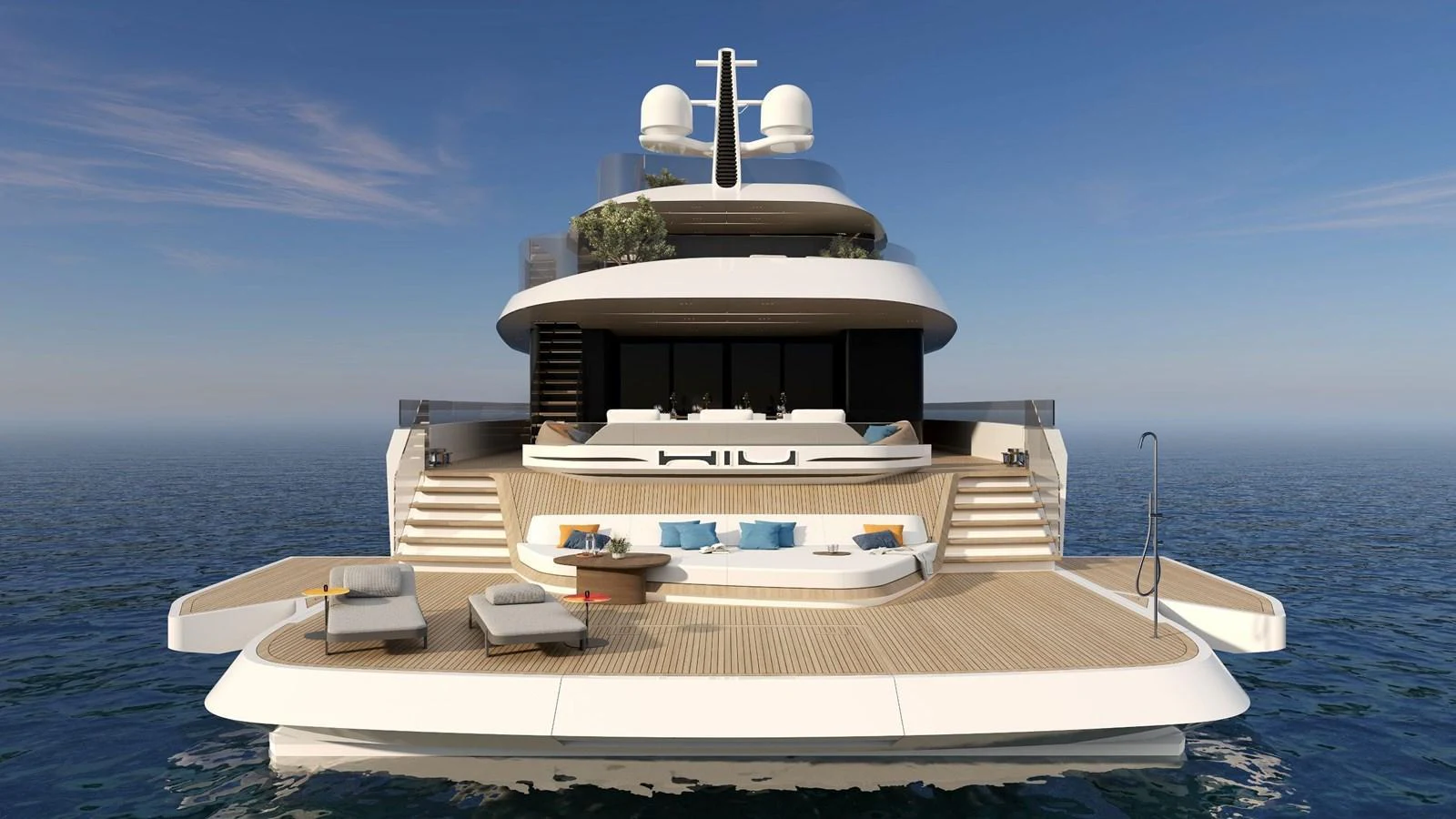 The yacht's aft deck offers a spacious and luxurious lounging area with modern furnishings and direct access to the water. aboard HIU Yacht for Sale