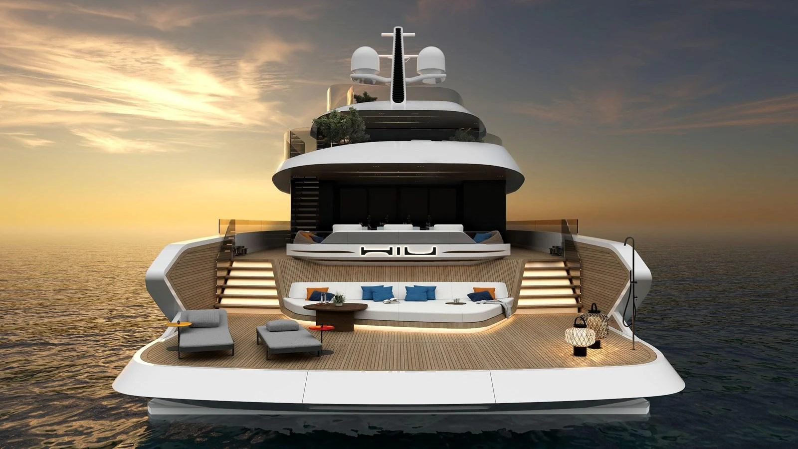 The yacht's aft deck offers a luxurious lounging area with stunning sunset views over the water. aboard HIU Yacht for Sale