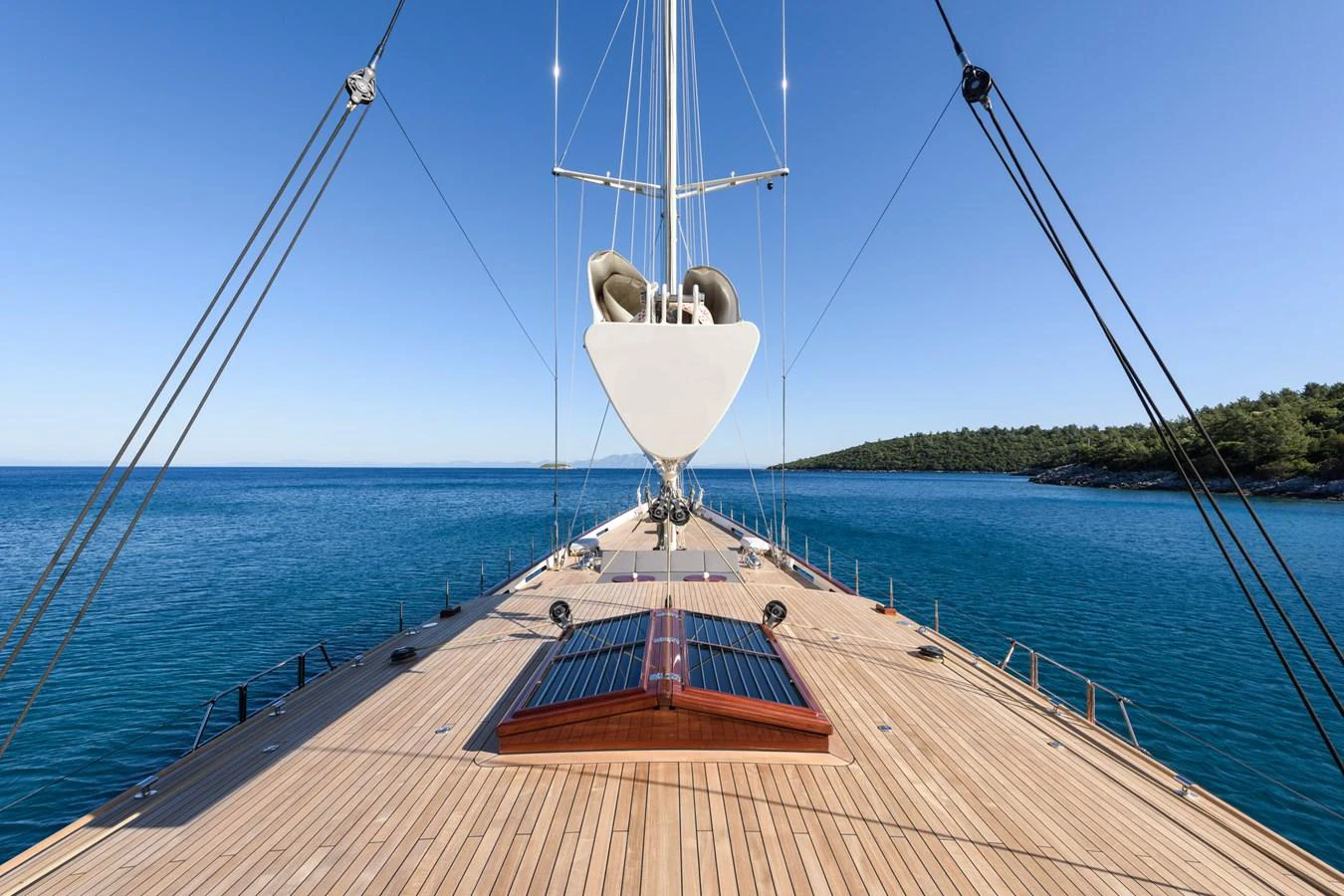 The yacht's foredeck offers a spacious and pristine area with a stunning view of the surrounding sea. aboard SALLYNA Yacht for Sale
