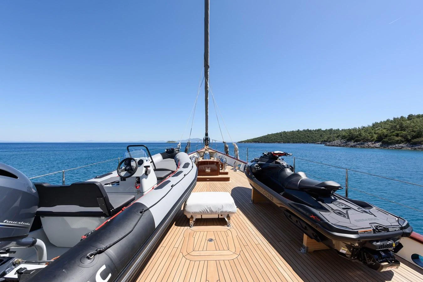 The yacht's deck is equipped with a tender and a jet ski, offering a perfect setup for water adventures. aboard SALLYNA Yacht for Sale