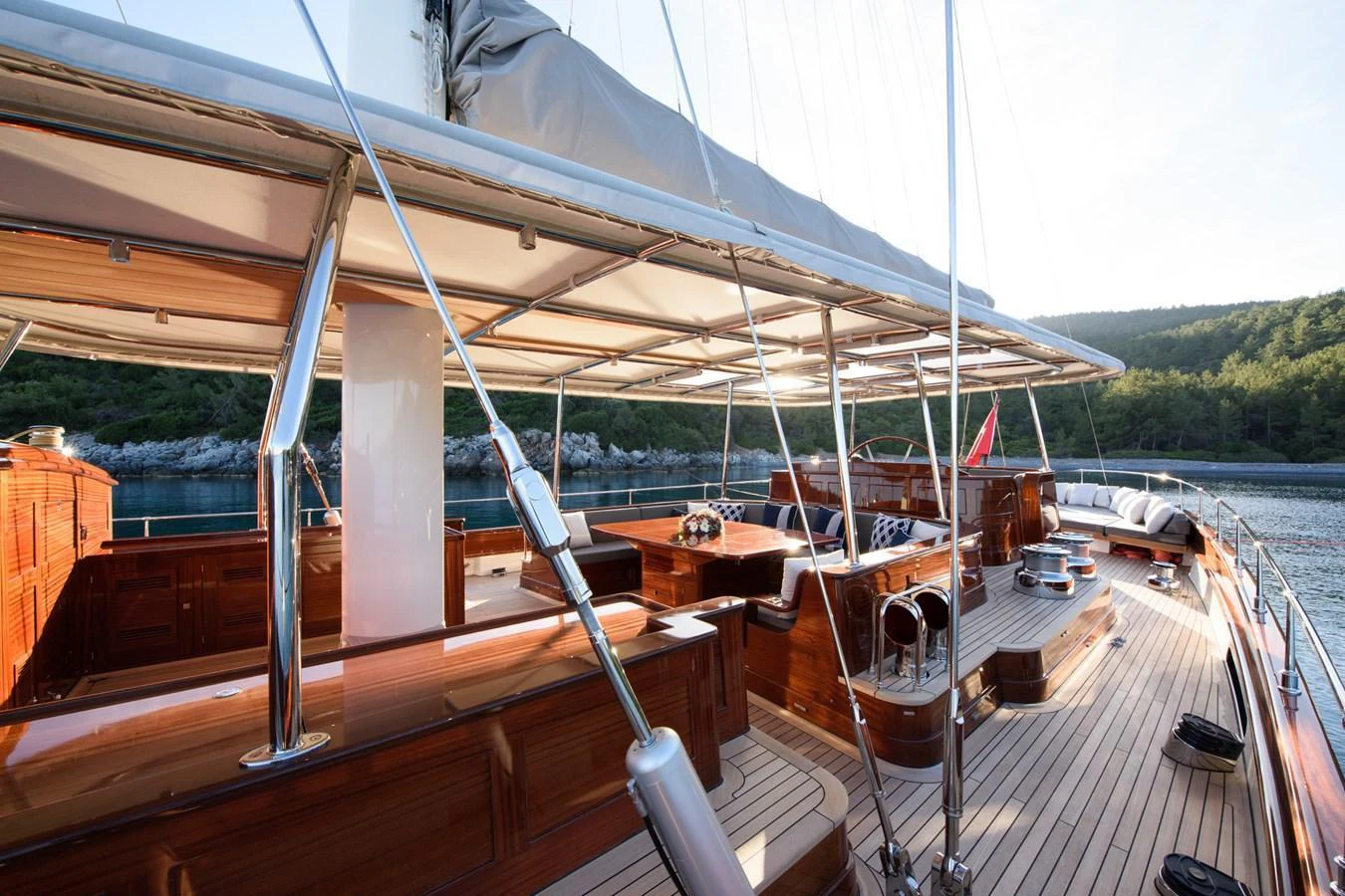 The yacht's deck features elegant wooden finishes and ample seating areas, perfect for relaxation and socializing. aboard SALLYNA Yacht for Sale