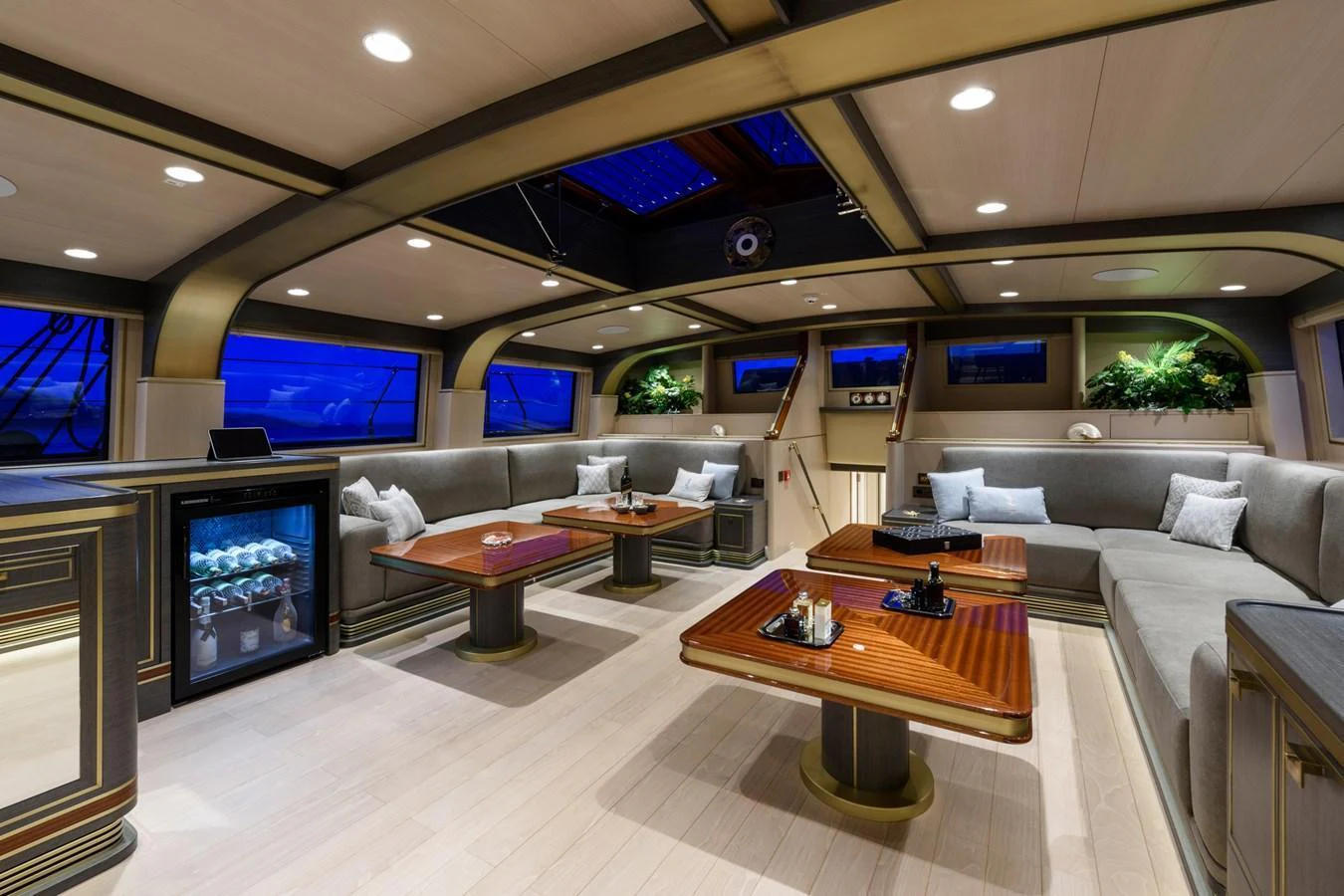 The yacht's salon offers a luxurious and spacious seating area with elegant furnishings and ambient lighting. aboard SALLYNA Yacht for Sale