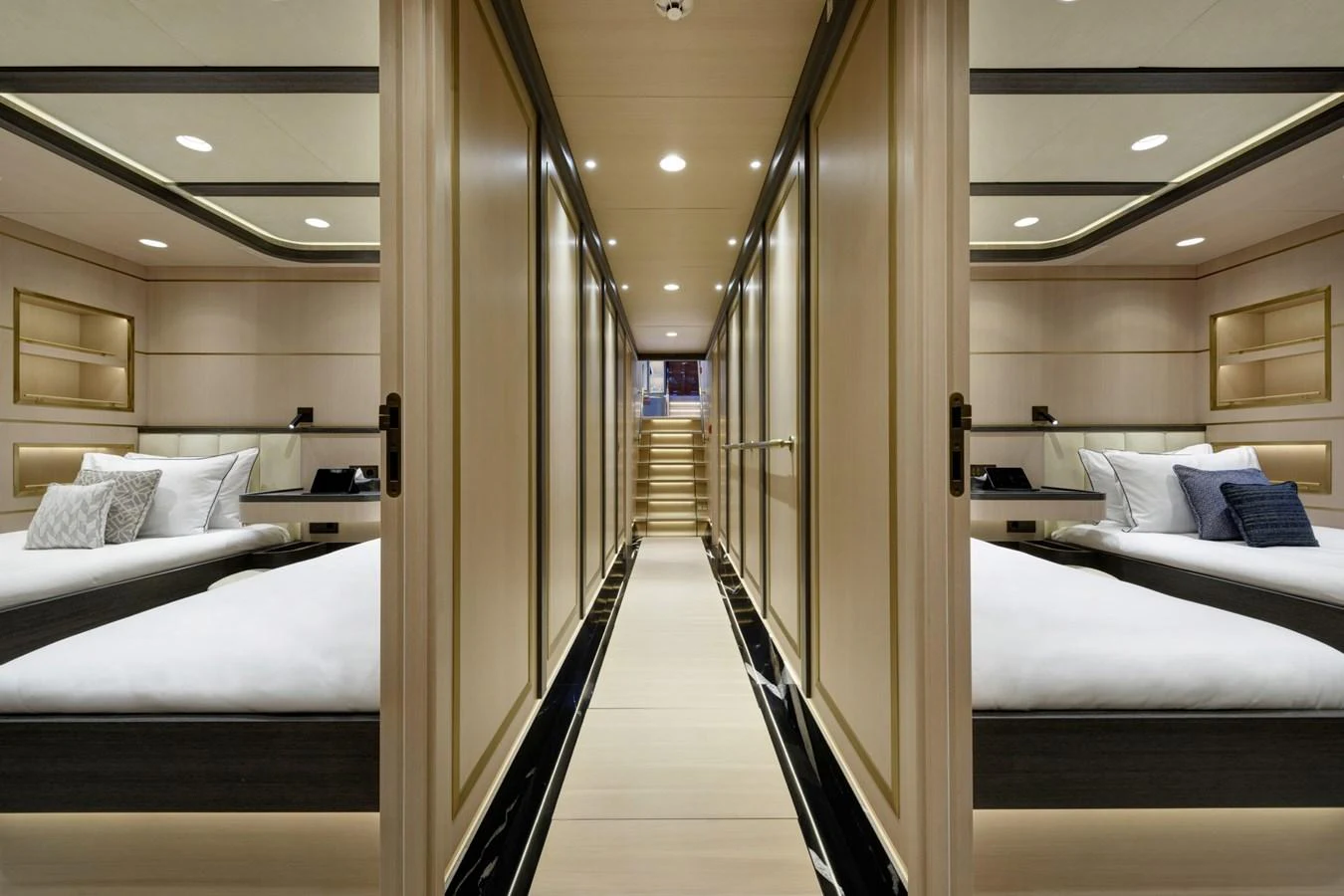 The image showcases a luxurious guest stateroom with twin beds and elegant wood paneling. aboard SALLYNA Yacht for Sale