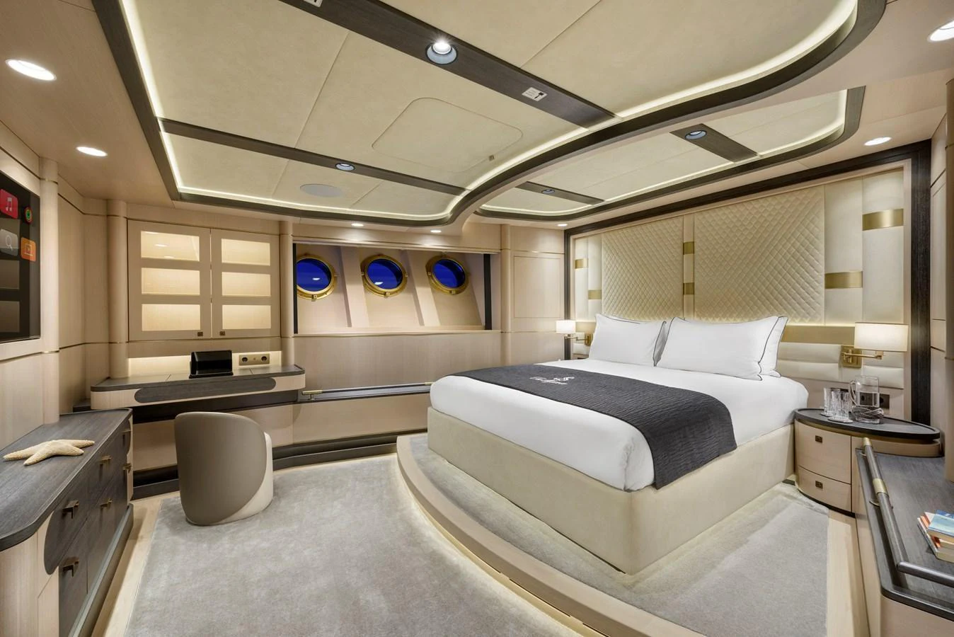 The master stateroom features a luxurious bed, elegant furnishings, and modern lighting. aboard SALLYNA Yacht for Sale
