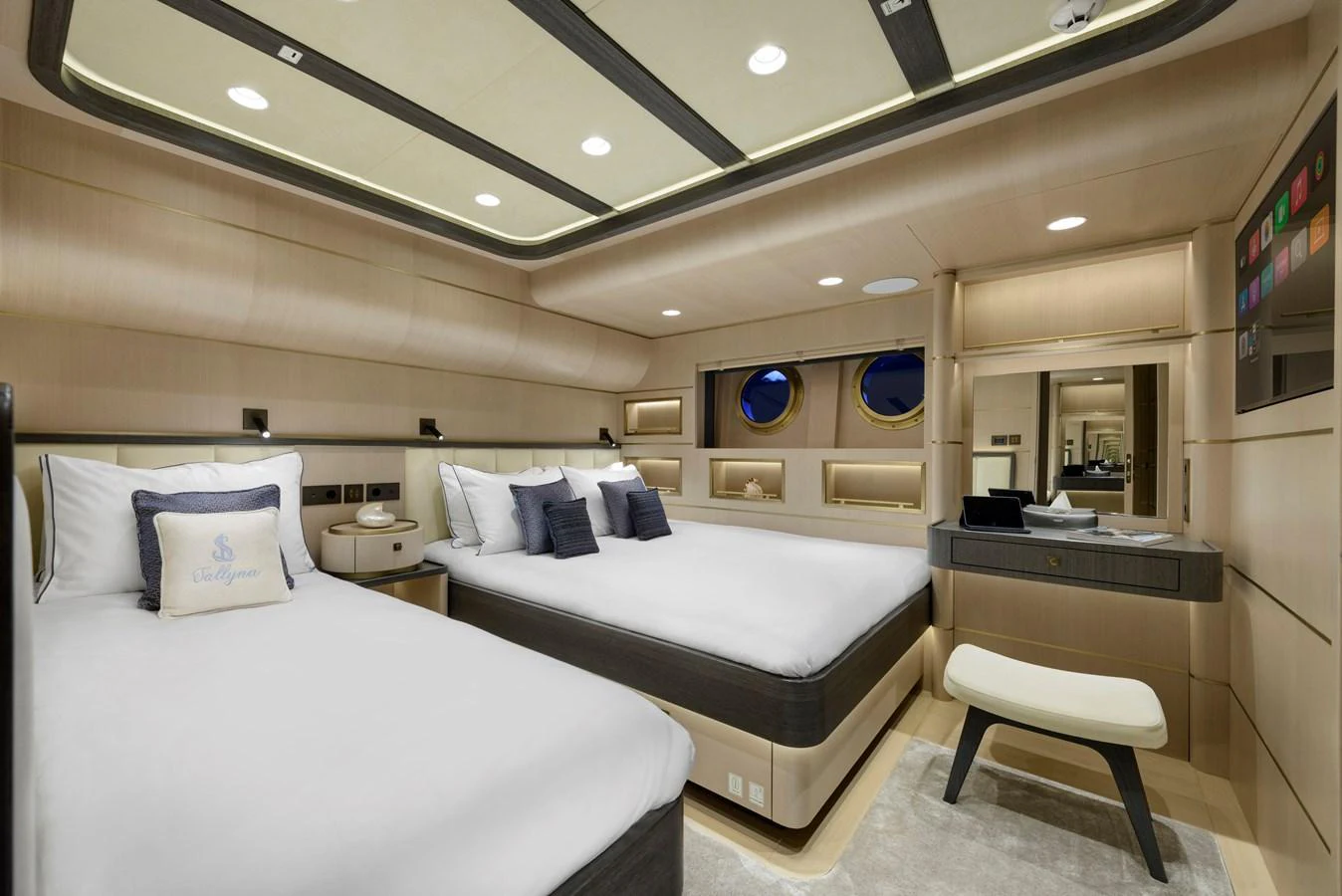 The guest stateroom features twin beds, modern lighting, and elegant decor for a comfortable stay. aboard SALLYNA Yacht for Sale