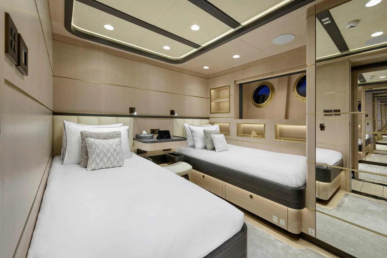 The guest stateroom features twin beds with modern decor and ample storage. aboard SALLYNA Yacht for Sale